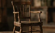A wooden spindle-back chair.